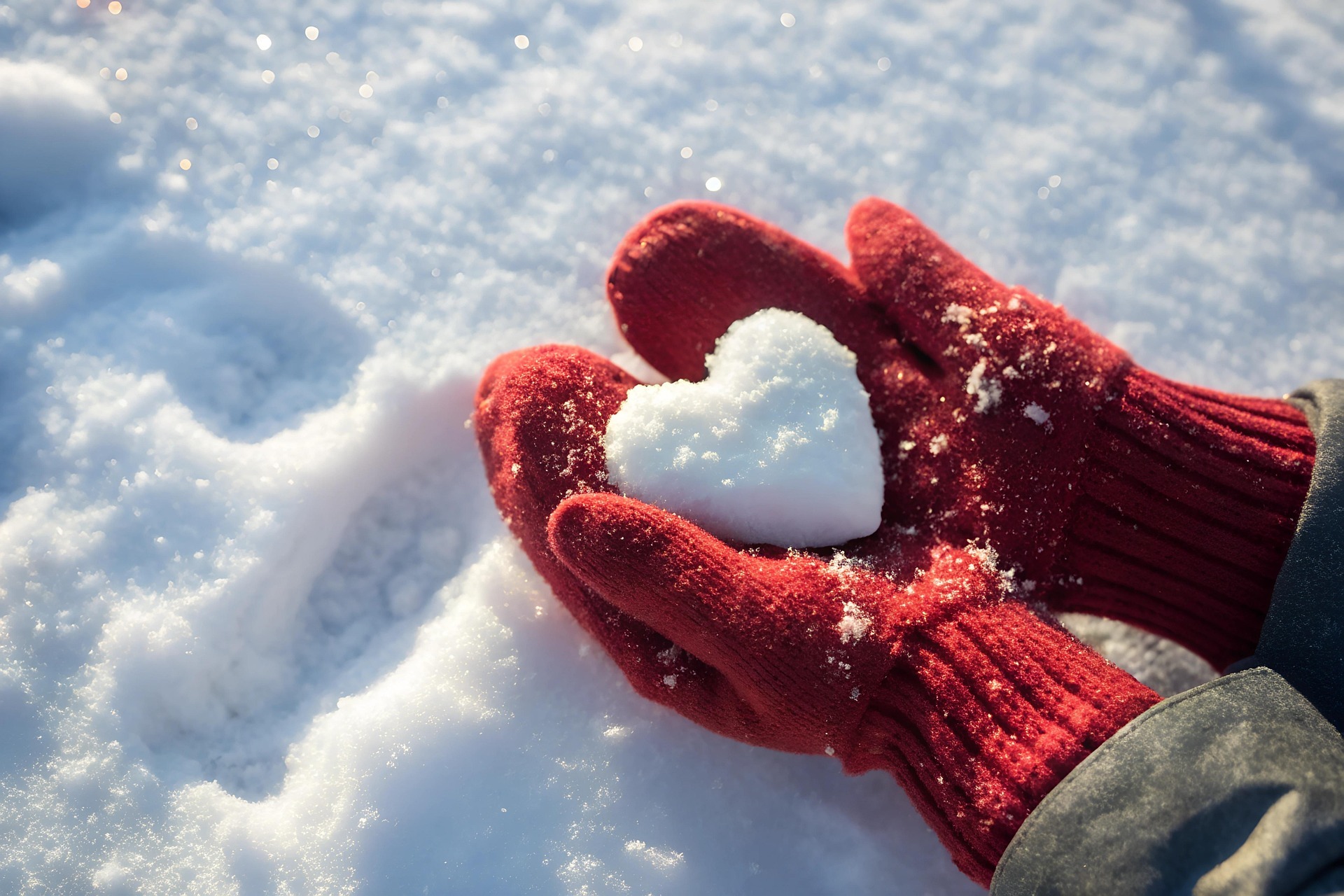 Person wearing insulated gloves during a cold-weather outdoor activity